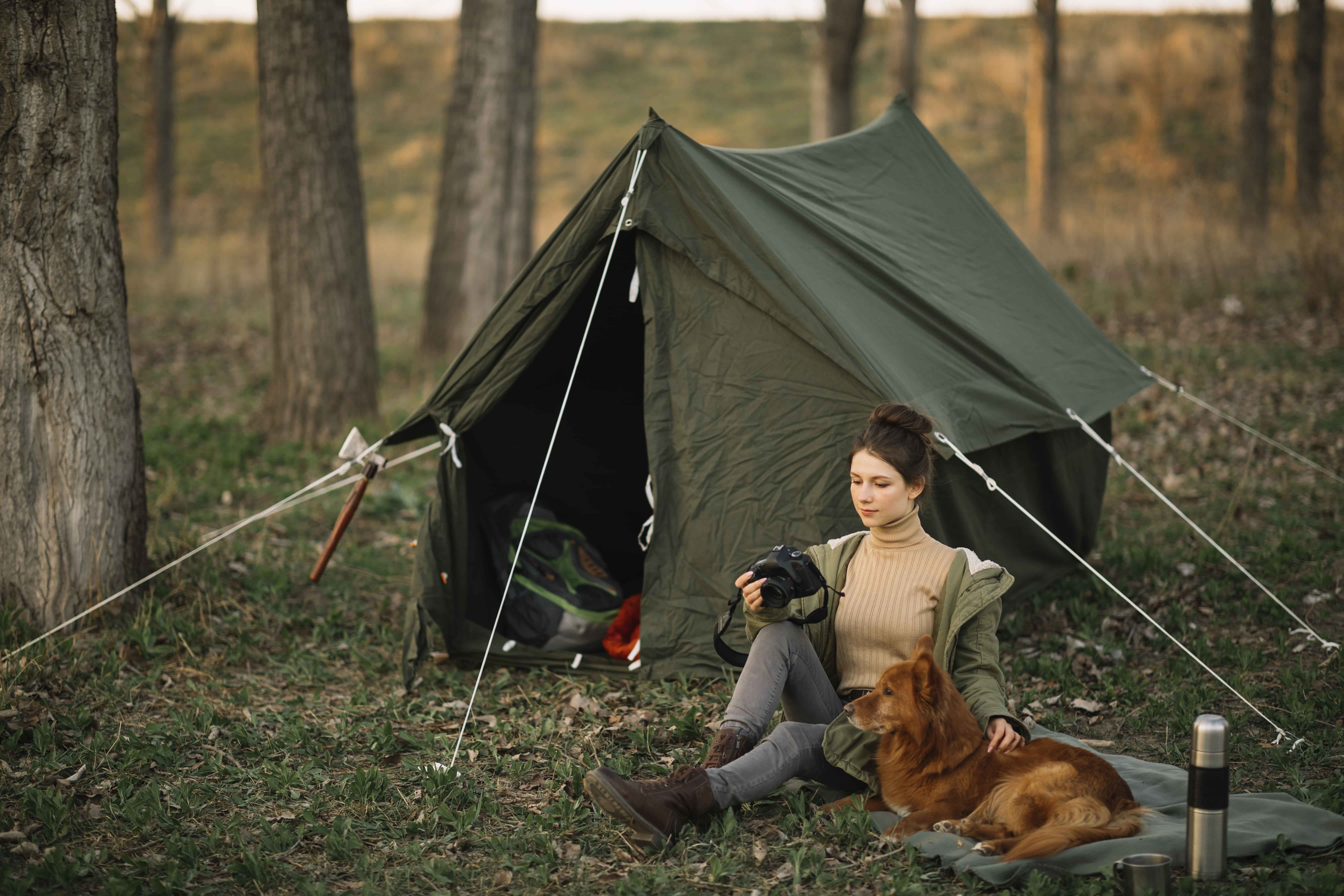 woman dog near tent