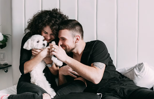 dog cuddling with family